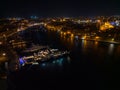 Super yachts in Grand Harbor Valletta Malta at night aerial towards Senglea town Royalty Free Stock Photo