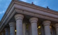 grand ionic columns support the cornice of a stately neoclassical building at twilight a dramatic, low-angle perspective Royalty Free Stock Photo