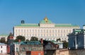 Grand Kremlin Palace on the background of old ruined houses.