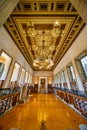 Grand Library Interior with Ornate Ceiling and Bookshelves