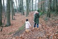 Grand mother and grandchild little girl walking together with the dogs in the countryside suburb area