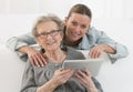 Grand-Mother and young grand-daughter with digital tablet Royalty Free Stock Photo