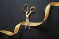 Grand opening. Gold scissors cutting gold satin ribbon, black background Royalty Free Stock Photo