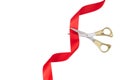 Grand opening. Top view of gold scissors cutting red ribbon on wite background. Royalty Free Stock Photo