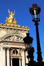 Grand Opera Paris Garnier golden statue and facade front view in front of old Lampposts france Royalty Free Stock Photo