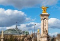 Grand Palais and golden statues of Pont Alexandre III bridge - Paris, France Royalty Free Stock Photo