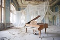 a grand piano covered in cobwebs in an abandoned ballroom