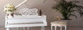 Grand piano in a luxury white classic interior with wine, palms and flowers. Royalty Free Stock Photo