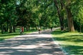 Grand Rapids, MI, USA - June 22nd 2019: Bicyclist riding down a park path in Grand Rapids Michigan