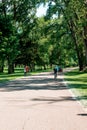Grand Rapids, MI, USA - June 22nd 2019: Bicyclist riding through a park in Grand Rapids