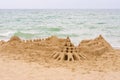 Grand sand castle on an empty beach