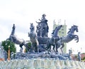Grand sculpture of a warrior on a chariot of four horses