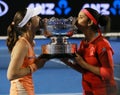 Grand Slam champions Martina Hingis of Switzerland and Sania Mirza of India during trophy presentation after doubles final match Royalty Free Stock Photo