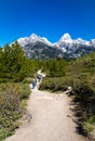 Grand Teton National Park, Jackson Hole, Wyoming, USA, May 31, 2021, Group of hikers on the trail from Taggart Lake Royalty Free Stock Photo