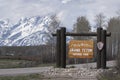 Grand Teton National Park sign with mountains in background Royalty Free Stock Photo