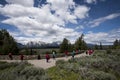 Grand Teton national Park at the Snake River overlook viewing point, with tourists wearing colorful clothes and taking photographs Royalty Free Stock Photo