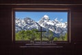 Grand Teton peaks view from the wooden Chapel of Transfiguration window Royalty Free Stock Photo