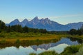 The Grand Teton sunrise reflection at Schwabacher`s Landing in Grand Teton National Park