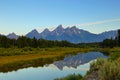 The Grand Teton sunrise reflection at Schwabacher`s Landing in Grand Teton National Park Royalty Free Stock Photo