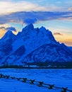 Grand Tetons at alpenglow sunset under lenticular clouds in Grand Tetons National Park in Wyoming