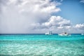 Grand Turk, Turks and Caicos Islands - December 29, 2015: powerboats in turquoise sea on cloudy sky. Boats on idyllic seascape. Wa