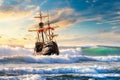 Grand view of an old sailing ship from the times of pirates on the high seas with big waves Royalty Free Stock Photo