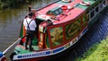 Shire Horse pulls a barge on The Grand Western Canal Tiverton In Devon