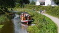 Shire Horse pulls a barge on The Grand Western Canal Tiverton In Devon