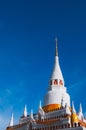 Grand white pagoda of Wat Pha Kho or Wat Ratchapraditsathan temple in summer day, Songkhla