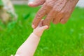 Grandad's and baby's hands Royalty Free Stock Photo