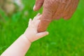 Grandad's and baby's hands Royalty Free Stock Photo