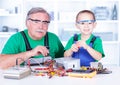 Grandchild disassembling PC power supply Royalty Free Stock Photo