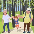 Grandchild with grantparents walking at park