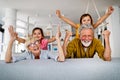 Grandchildren having fun at home while playing with their grandparents Royalty Free Stock Photo