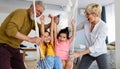 Grandchildren having fun at home while playing with their grandparents Royalty Free Stock Photo