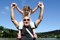 Granddad carry his grandchild