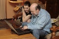Granddad and grandchild at laptop PC Royalty Free Stock Photo