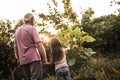 Granddad and granddaughter walking in botanical garden