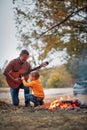 Granddad with grandson with guitar