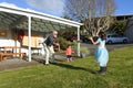 Granddad plays with his daughters outdoor