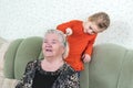 Granddaughter combing her grandmother