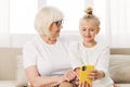 Granddaughter grandmother child family smiling phone selfie hugging togetherness bonding Royalty Free Stock Photo