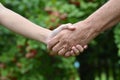 Portrait of granddaughter and grandmother holding hands outdoors Royalty Free Stock Photo