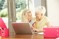 Granddaughter And Grandmother At Home Royalty Free Stock Photo