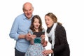 Granddaughter and grandparents using tablet Royalty Free Stock Photo