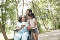 Granddaughter have surprise to grandmother sitting