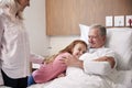 Granddaughter Hugging Grandfather On Family Hospital Visit Royalty Free Stock Photo