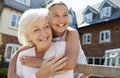 Granddaughter Hugging Grandmother On Bench During Visit To Retirement Home Royalty Free Stock Photo
