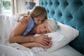 Granddaughter kissing her grandmother on bed