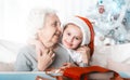 Granddaughter in sit hugging with grandma Royalty Free Stock Photo